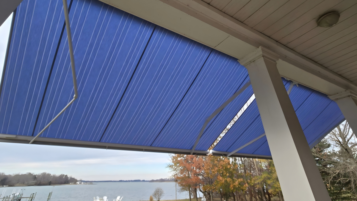 Retractable awning extended over waterfront patio providing shade and sun protection for outdoor living space in Maryland Delaware