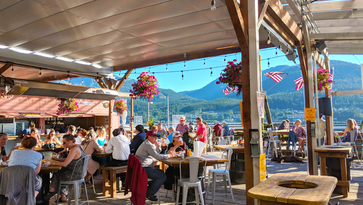 Commercial Retractable Canopy for Outdoor Restaurant Seating Busy outdoor restaurant patio with retractable canopy providing shade for guests dining outdoors