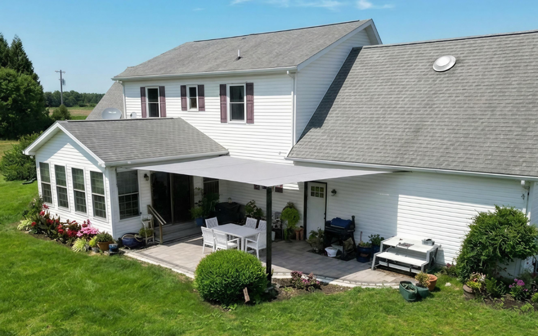 Finished custom shade sail installation creating comfortable shade over a residential patio on Maryland's Eastern Shore.
