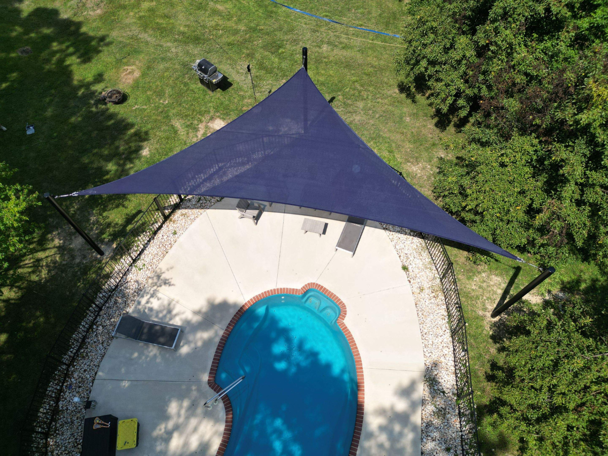 Custom shade sail installation over a residential swimming pool in Princess  Anne completed by Shade Sail Systems.