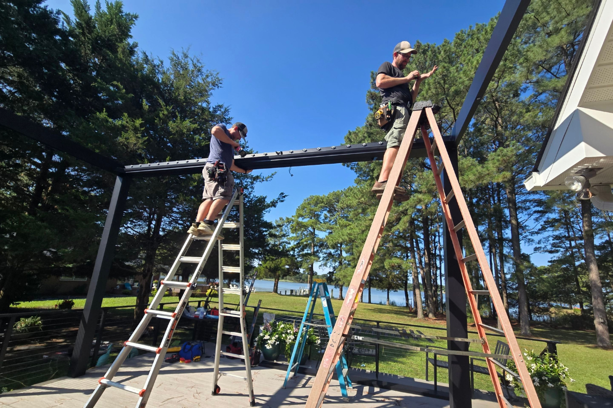 BCO team installing the frame for a motorized louvered pergola in Royal Oak, Maryland
