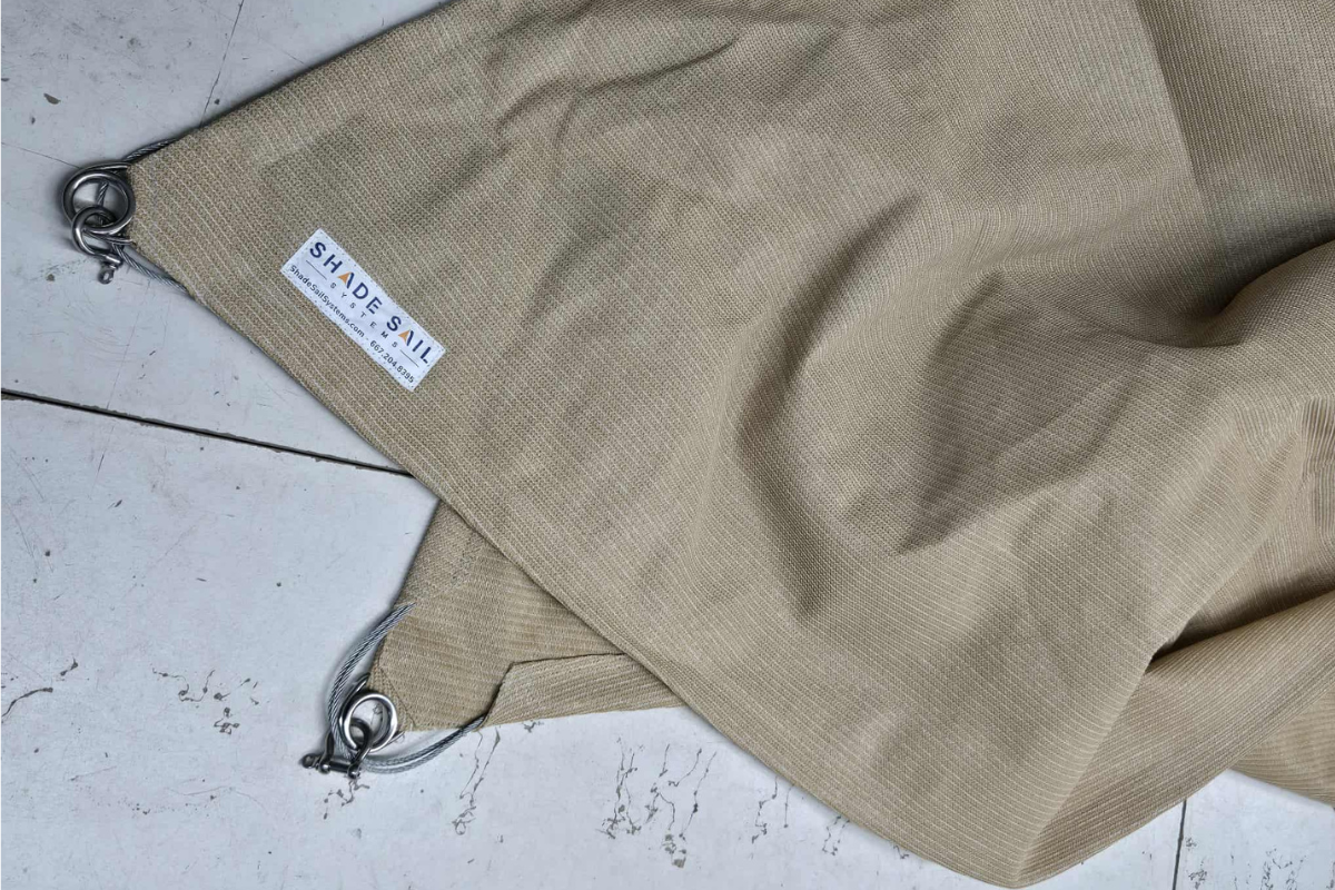 Close-up inspection of outdoor fabric for signs of wear or damage.