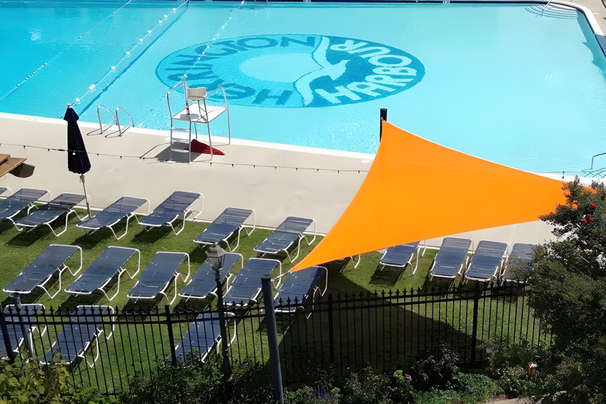 Bright orange shade sail beside the swimming pool at Herrington Harbour South marina