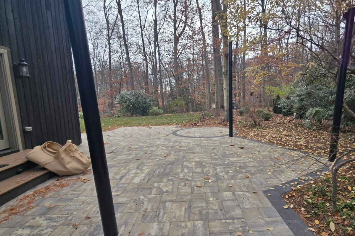 Shade Sail Systems fabric ready for inspection, repair, and storage. Patio after the shade sail has been removed for fall cleaning and storage.