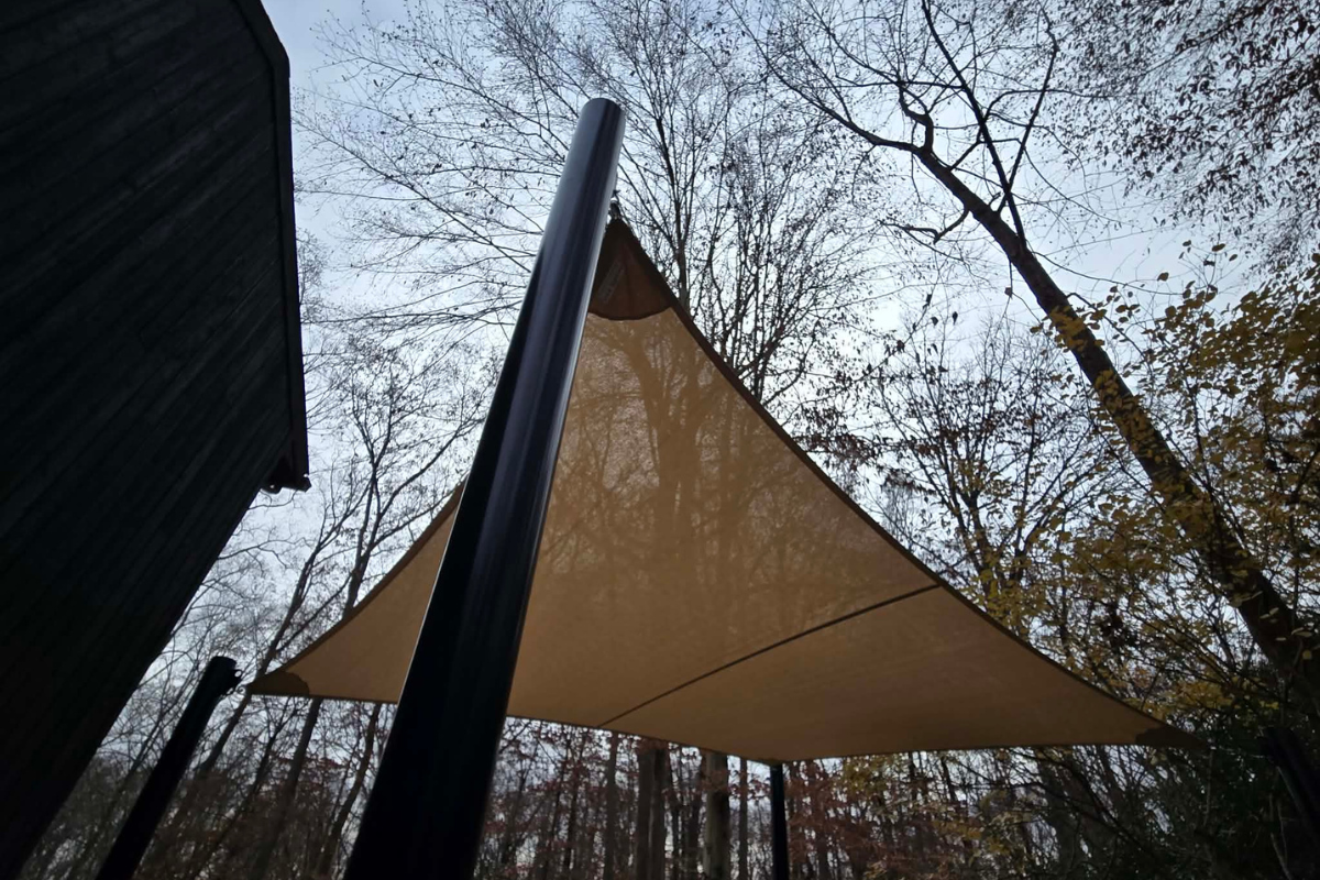 Custom Shade Sail in Fall Custom shade sail over an outdoor patio during the fall season.