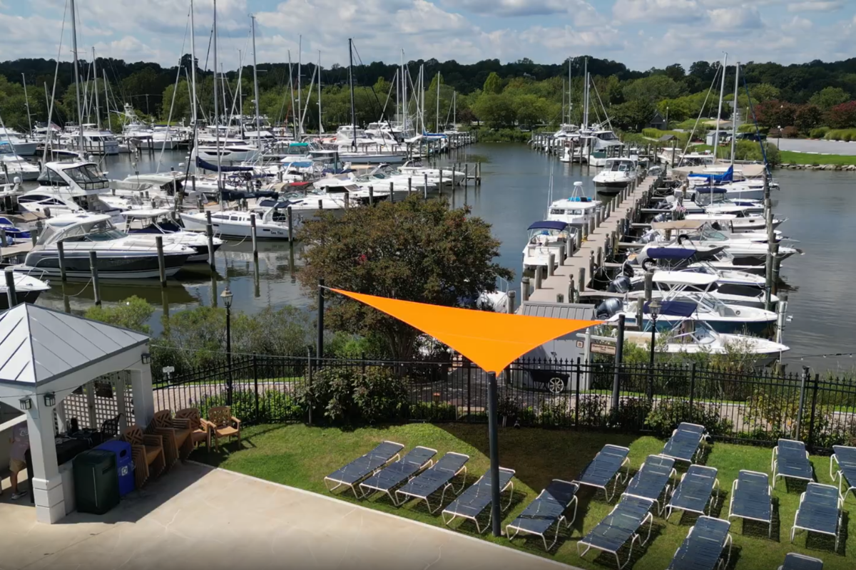 Orange commercial shade sail overlooking the marina at Herrington Harbour South Maryland